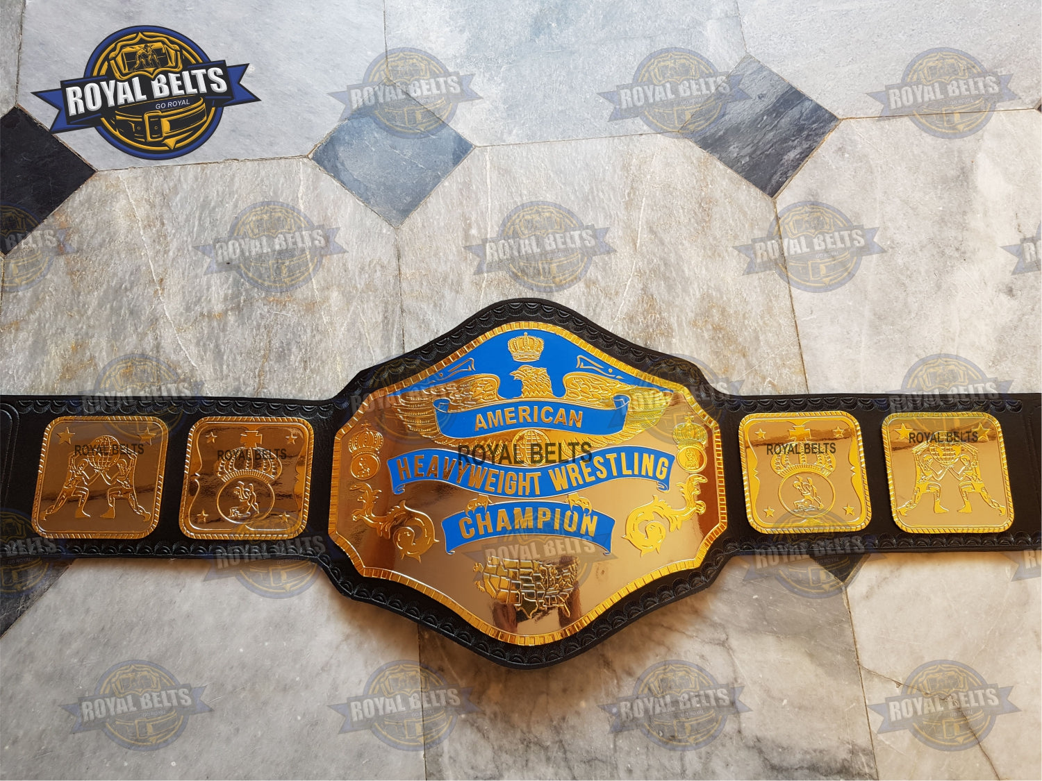 Close-up of brass plated championship wrestling belt plates with deep etched detailing