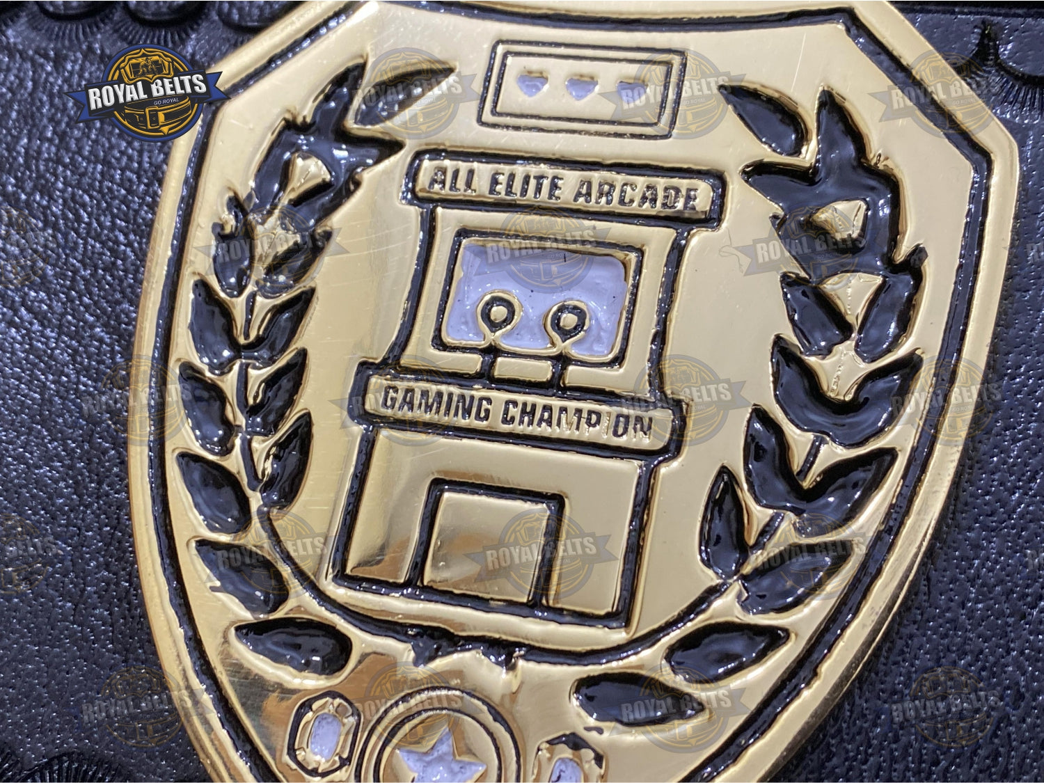 Arcade gaming title belt designed with bold center plate and polished surfaces