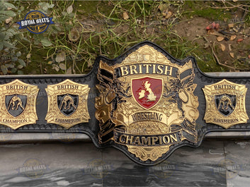 British World wrestling title belt featuring engraved UK crest plates, polished gold finish, snap leather strap Manufacture by Royal Belts