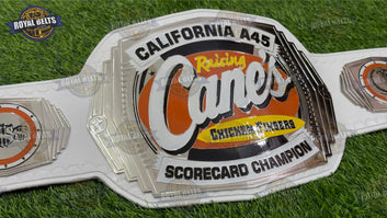 Raising Cane’s Chicken Fingers championship belt featuring engraved logo plates, polished chrome, cowhide genuine leather Made by Royal Belts