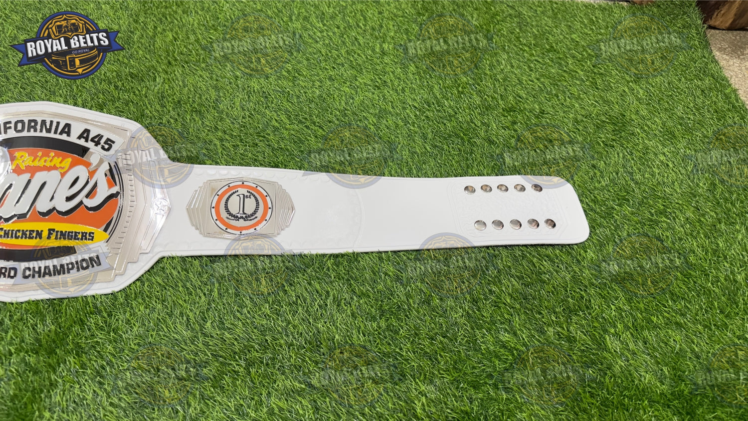 Raising Cane’s custom title belt featuring engraved logo detail, premium metal, snap fit leather , luxury metal finish