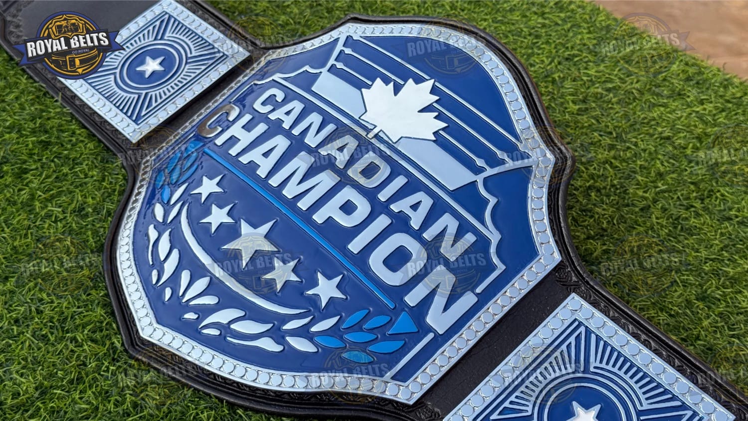 Canadian title belt featuring mirror-finish maple leaf plates, reinforced stitching, black leather backing