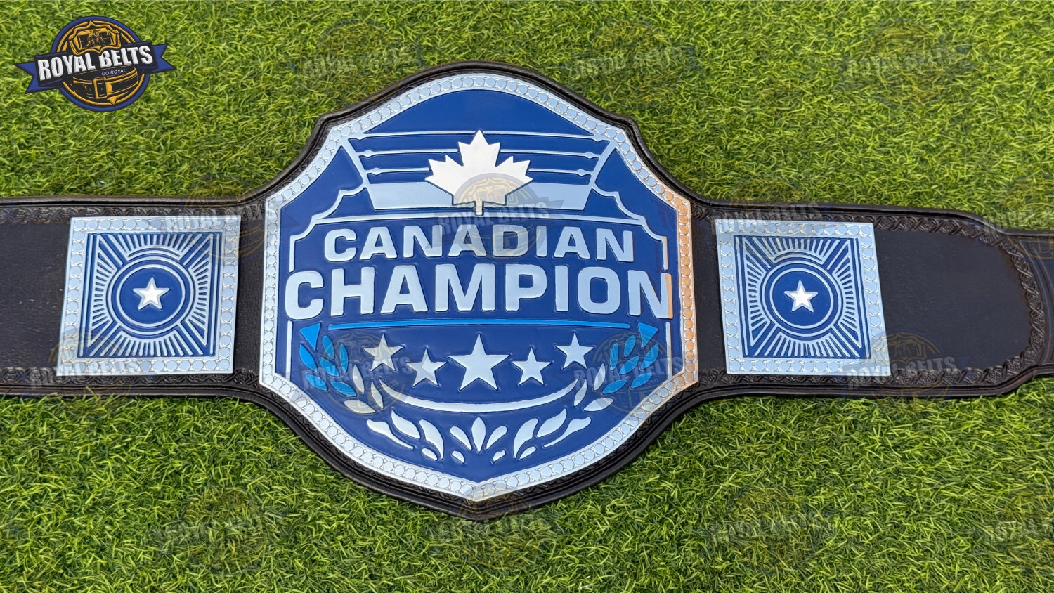 Canadian wrestling title belt featuring engraved maple leaf plates, polished chrome finish, snap leather strap 