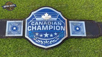 Canadian wrestling title belt featuring engraved maple leaf plates, polished chrome finish, snap leather strap 
