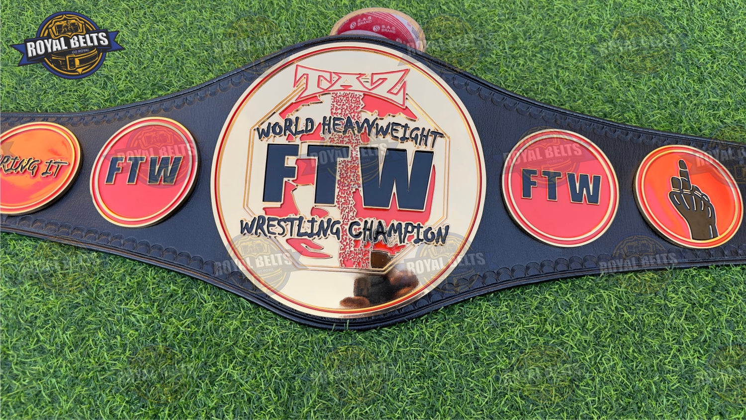 FTW TAZ World Heavyweight title belt featuring CNC cut metal plates and polished gold finish Handmade by Royal Belts