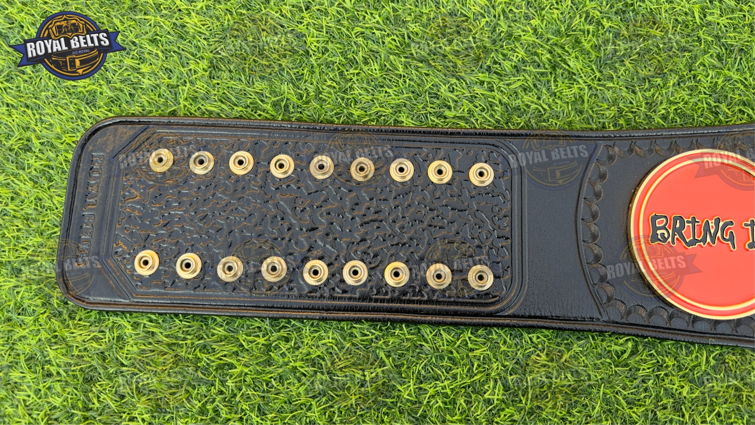 TAZ FTW World Heavyweight belt showing engraved borders and reinforced snap fasteners