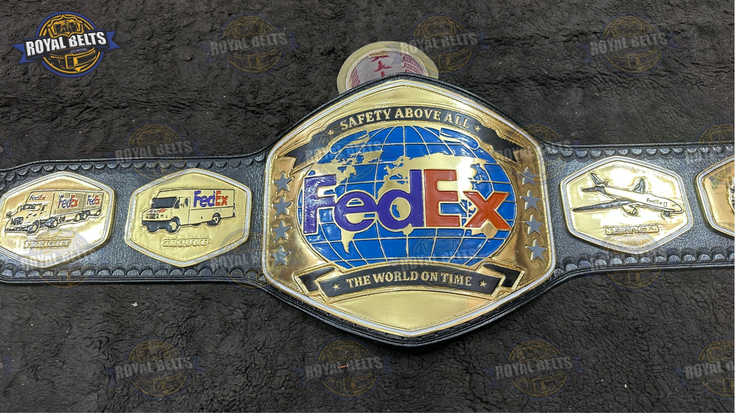 FedEx custom title belt with gold logo plates and black leather strap Manufacture by Royal Belts
