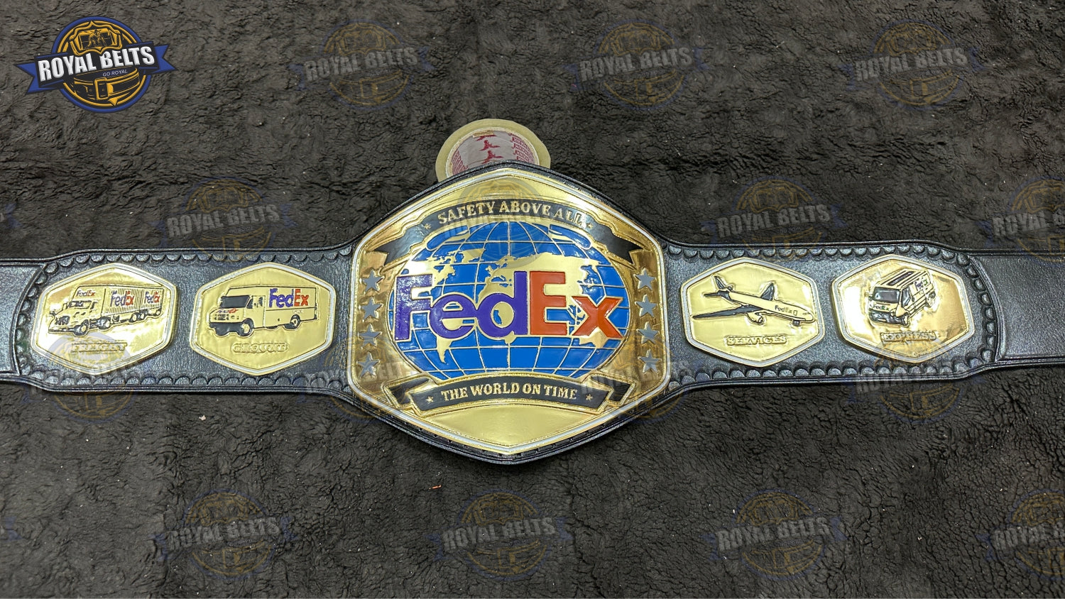 FedEx custom championship belt featuring engraved center logo and polished gold finish Handmade by Royal Belts
