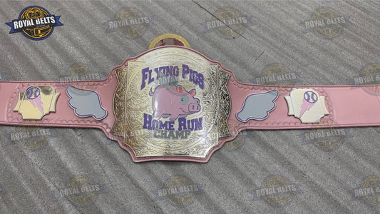Flying Pigs custom title belt with gold center plate, pink leather strap, engraved pig logo Manufacture by Royal Belts