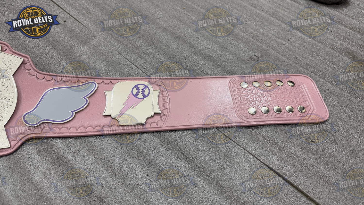 Flying Pigs mascot belt with raised logo engraving and curved heavyweight plates