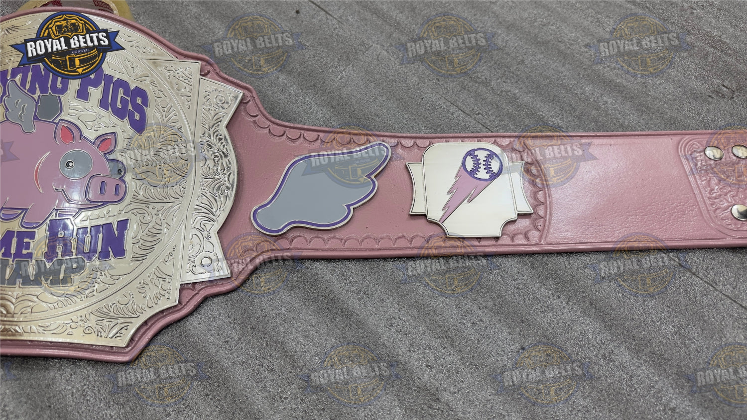 Custom mascot championship belt featuring Flying Pigs emblem and reinforced snap fasteners
