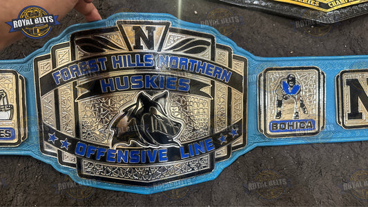 Forest Hills Northern title belt with custom huskies logo, gold plates, blue leather strap Made by Royal Belts 