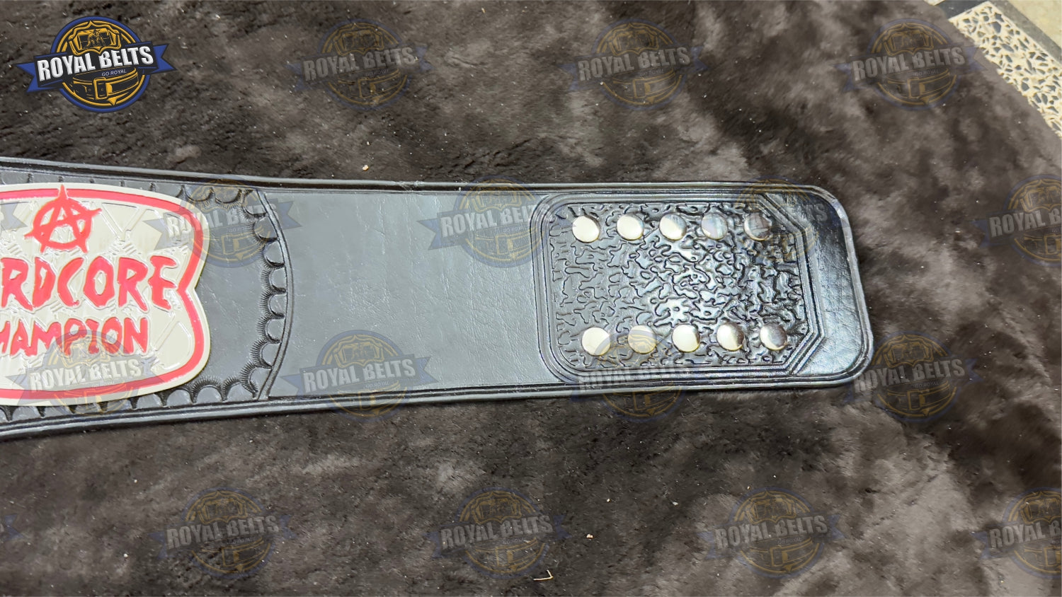 Hardcore wrestling title belt featuring heavyweight metal construction