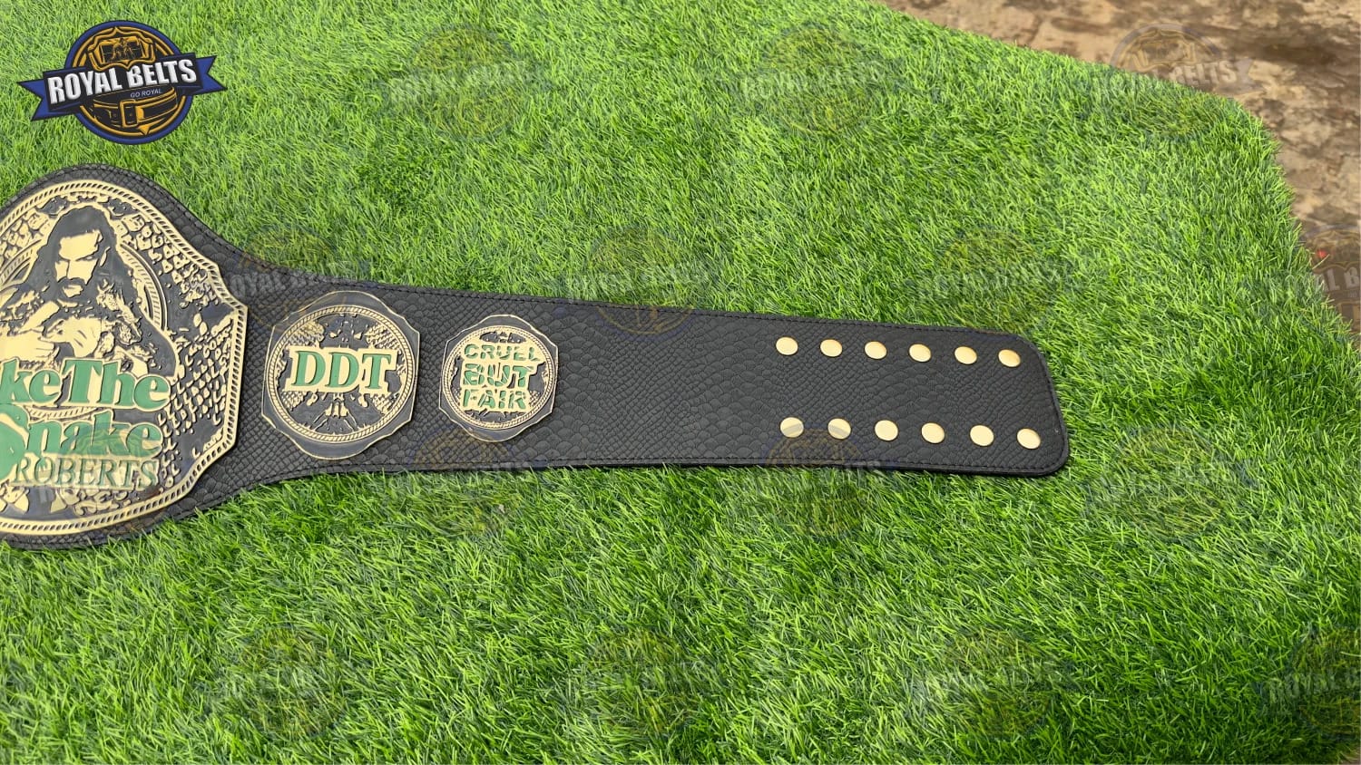 Championship title belt replica Jake The Snake with engraved gold detailing