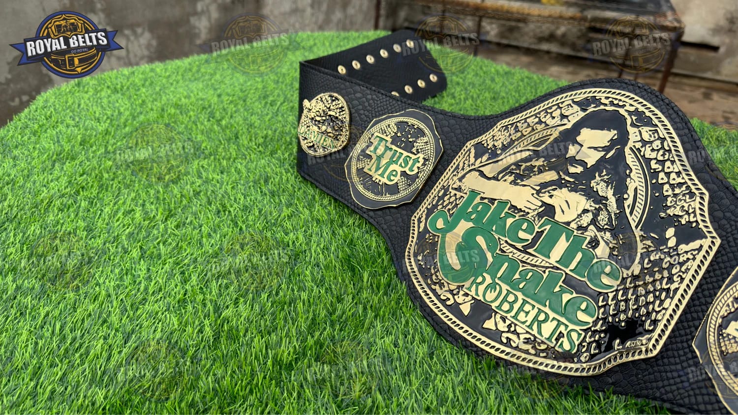 Jake Snake title belt collectible with polished gold metal plates
