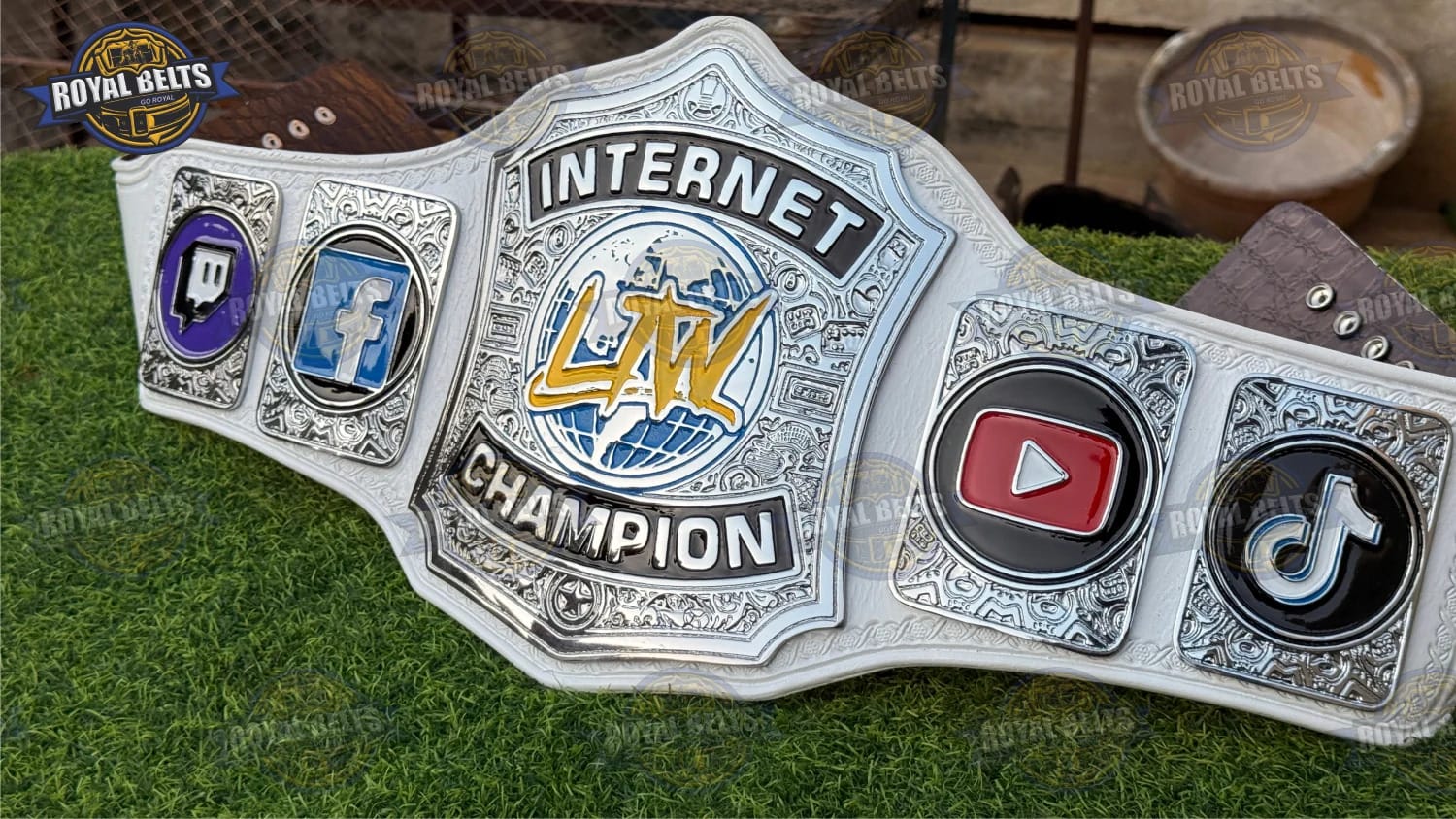 Custom wrestling championship belt featuring LTW Internet design and leather backing Crafted by Royal Belts