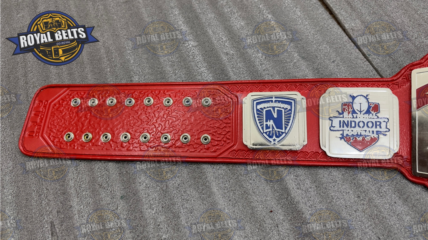 MVP National Championship Belt raised lettering, layered metal plates, stitched leather backing