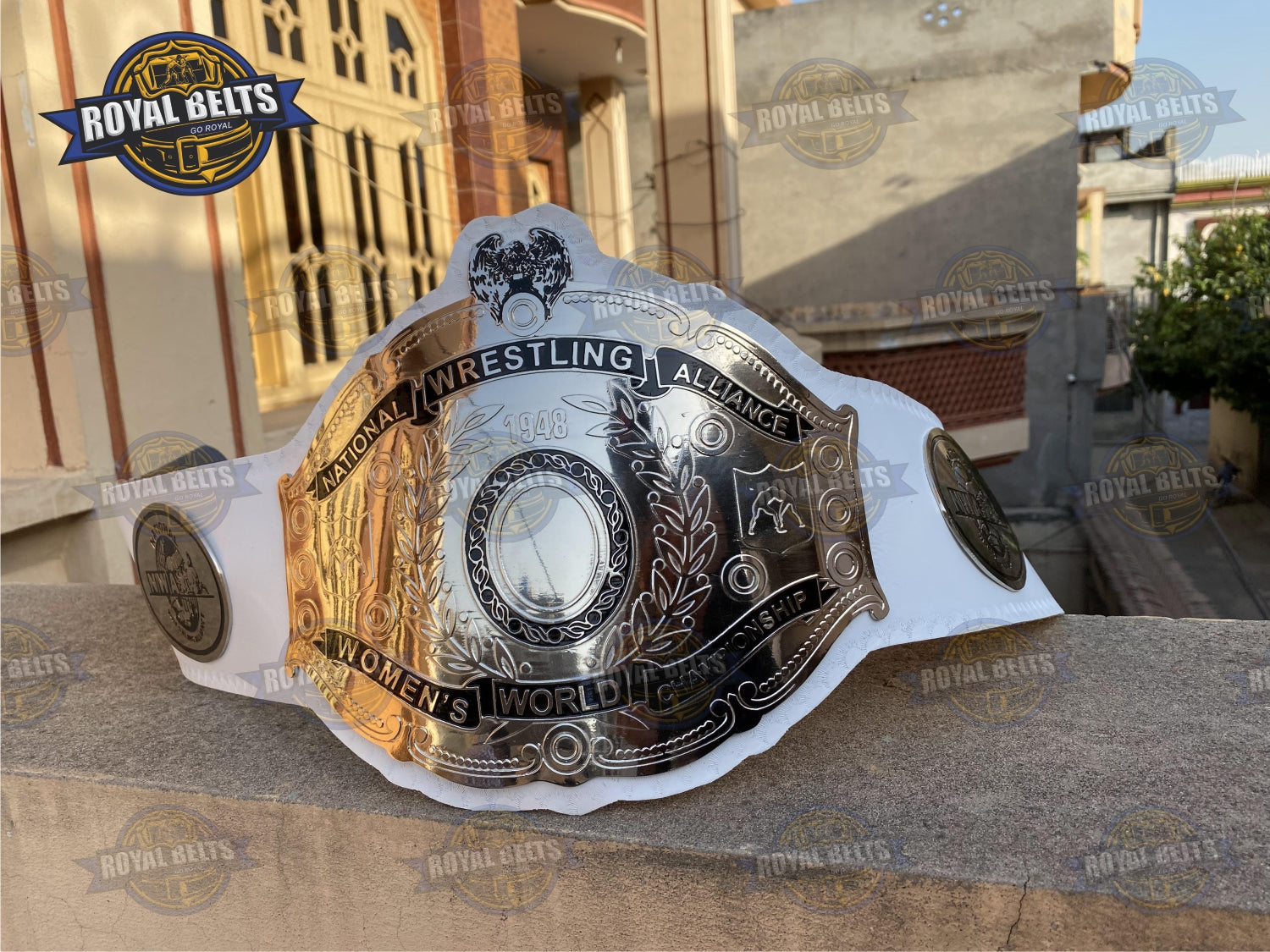 NWA Women’s Championship Belt featuring polished brass engraved logo, chrome side plates, smooth leather Made by Royal Belts