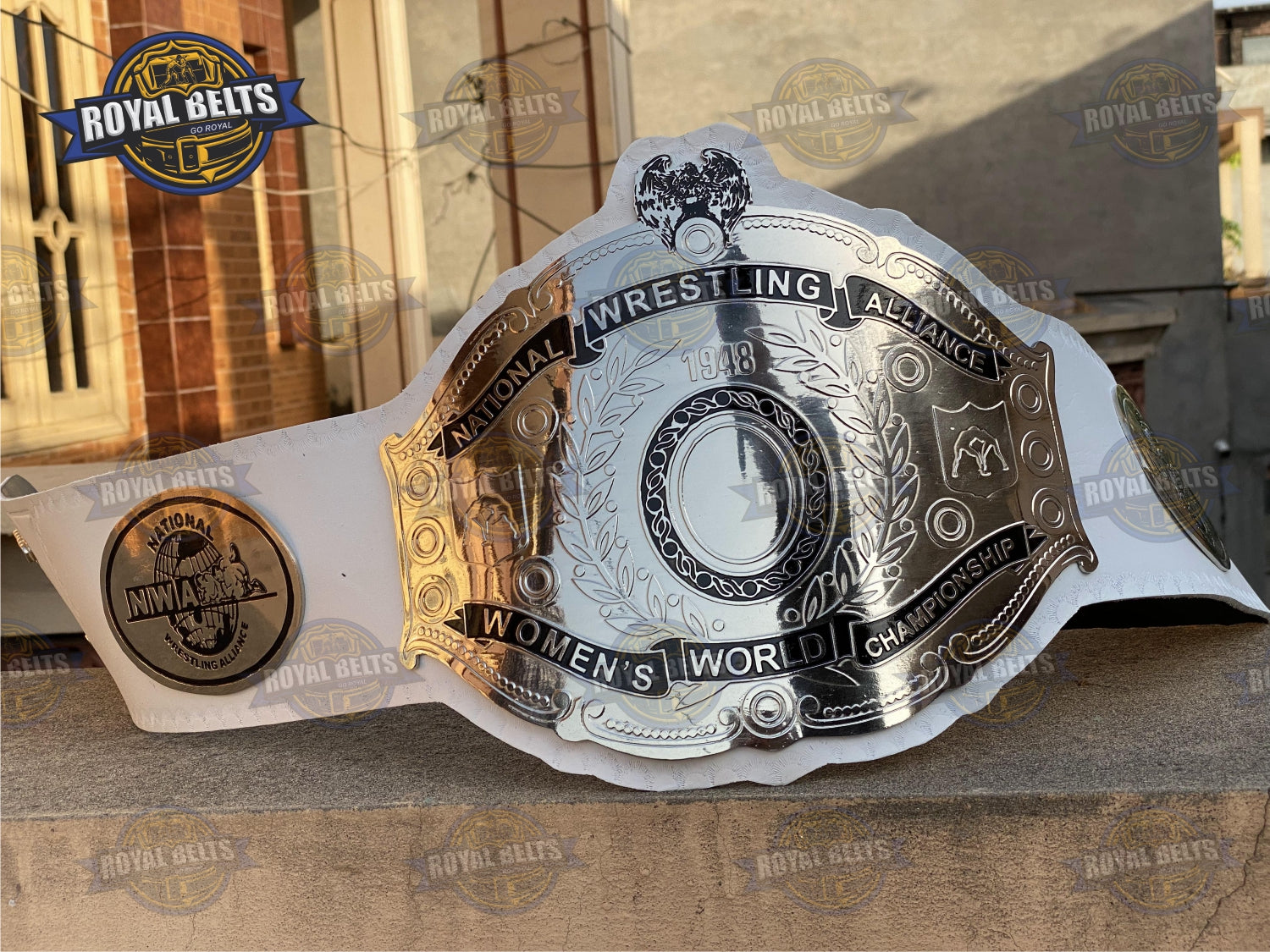NWA Women’s Championship Belt with high relief brass plating, white leather, chrome side logos