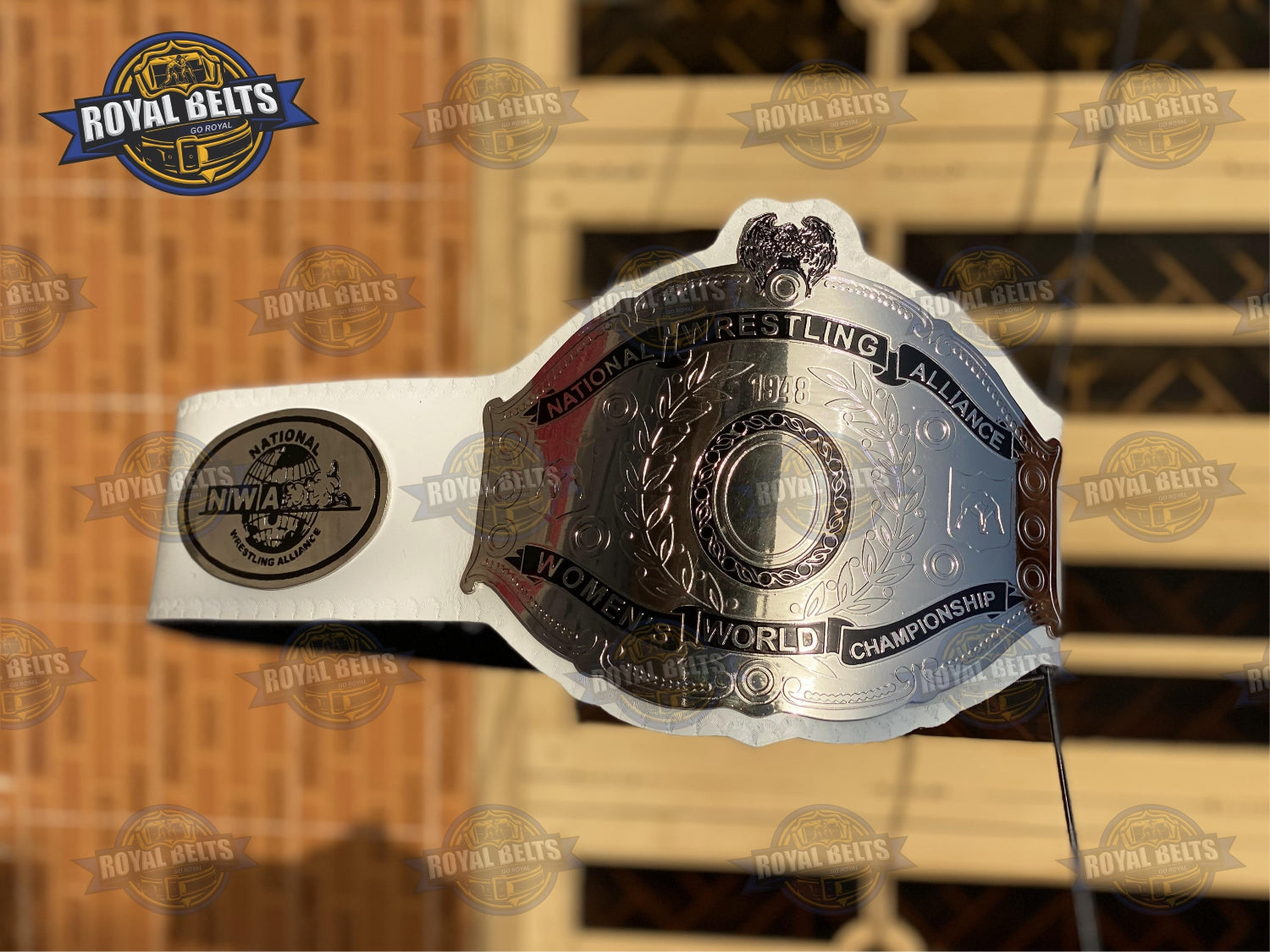 NWA Women’s Title Belt with brass plated metal plates, raised NWA logo, premium white leather backing