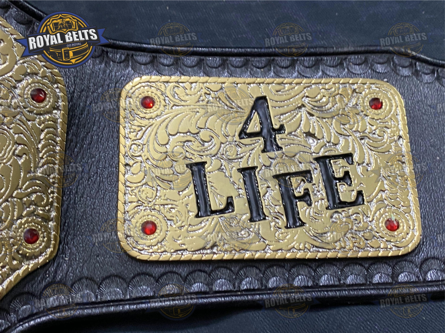 NWO Big Gold For Life Title Belt showcasing detailed engraved plates, black leather strap, adjustable fit