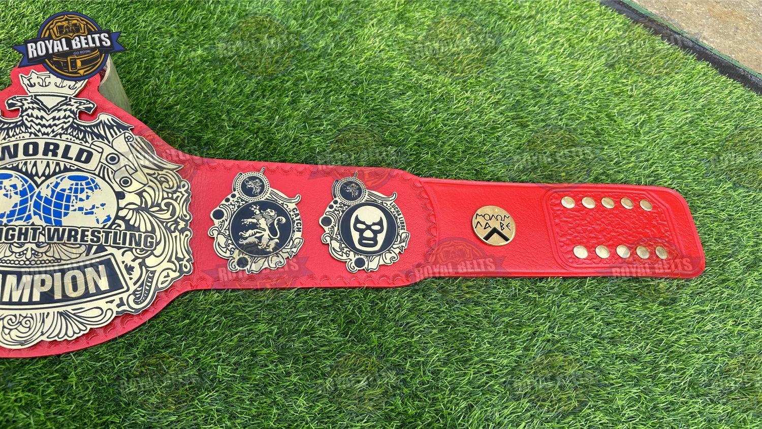 Red World Heavyweight title belt with raised center plate, mirror finish metal, stitched red leather Crafted by Royal Belts