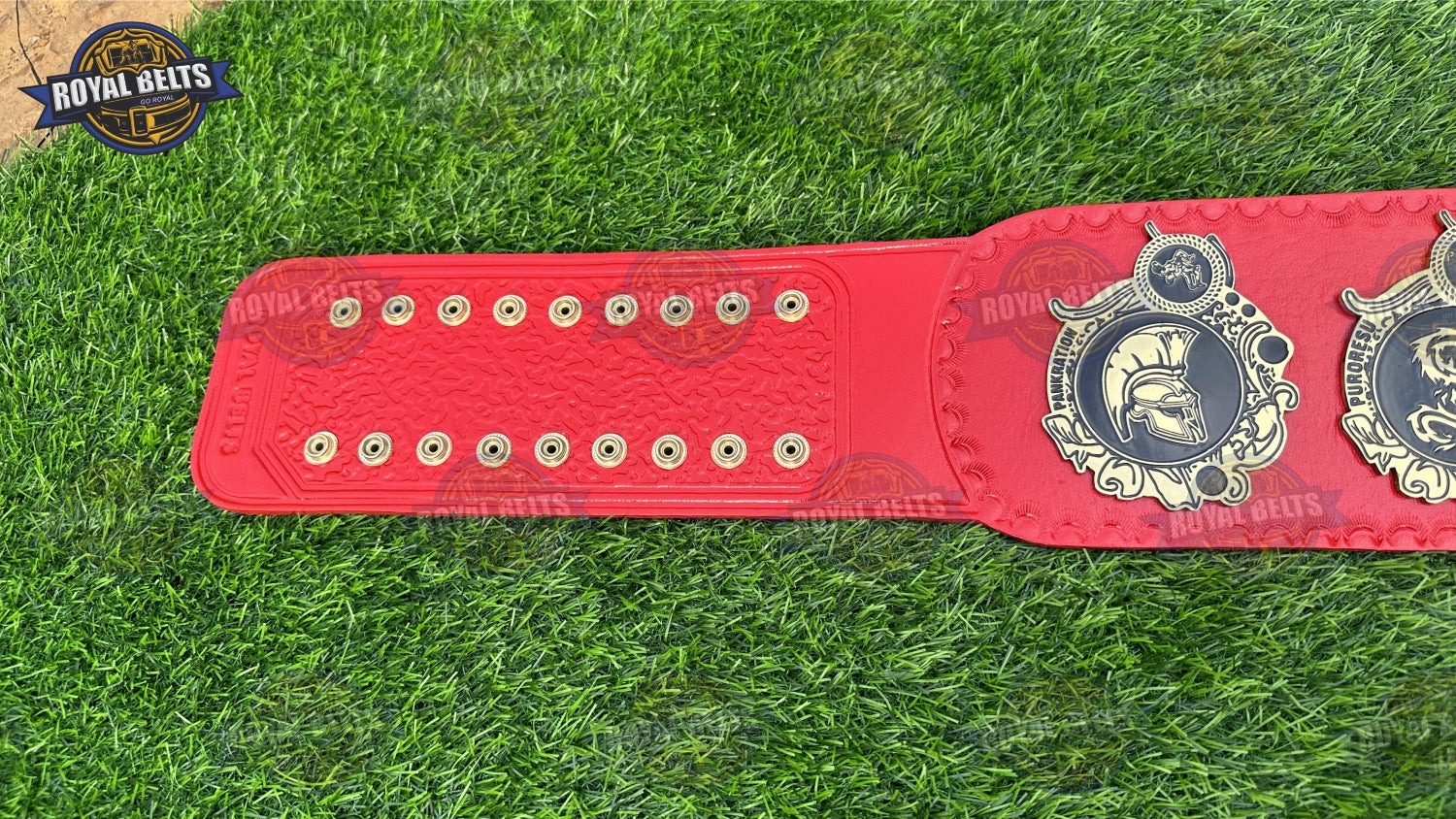World Heavyweight championship belt showcasing deep etched gold plates, adjustable red leather strap