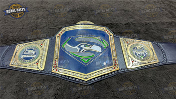 Seattle Seahawks championship title belt featuring engraved logo plates, polished gold finish, leather backing Made by Royal Belts