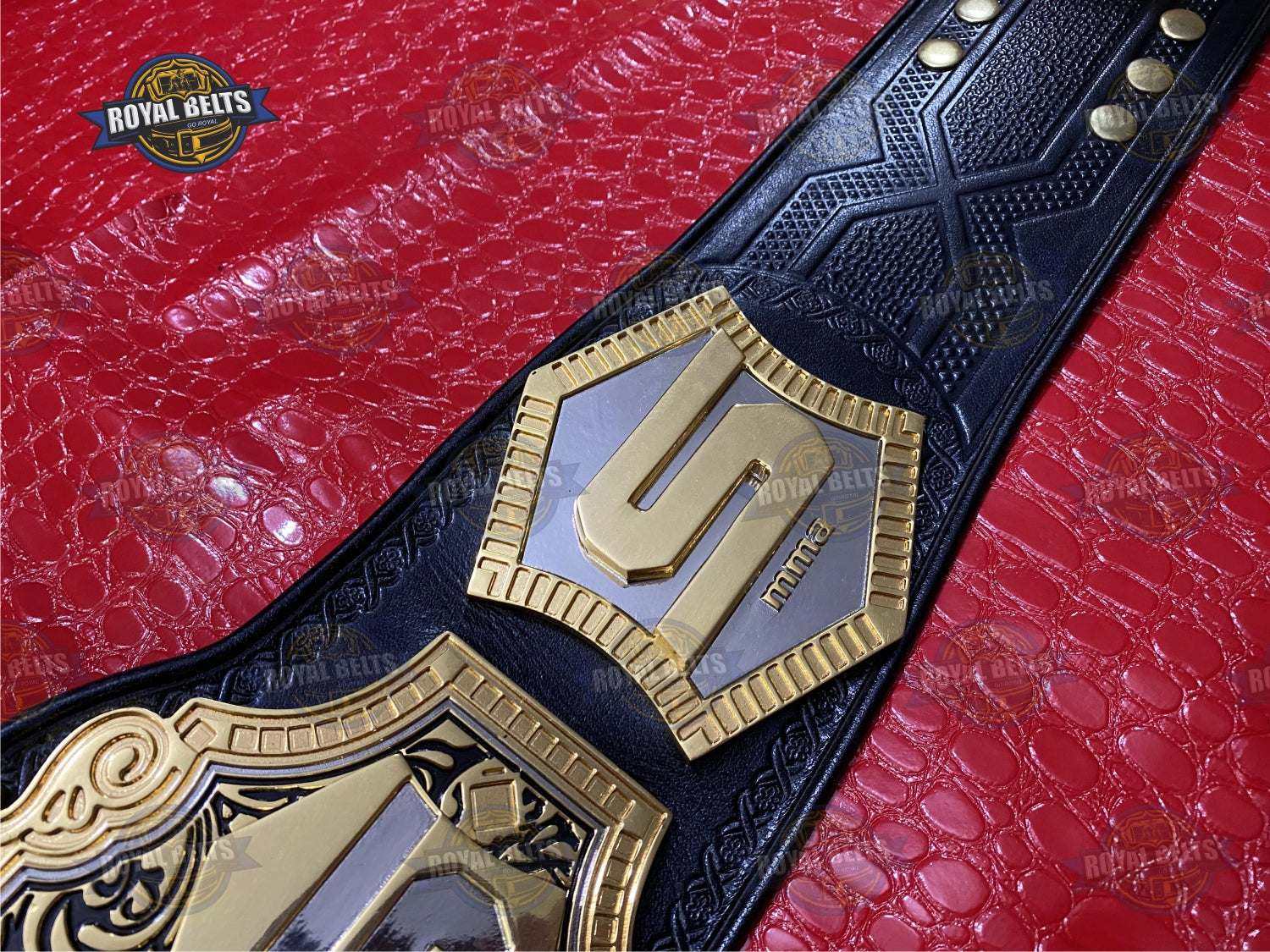Strikeforce championship belt showcasing deep engraving, triple layered gold plates, stitched leather strap