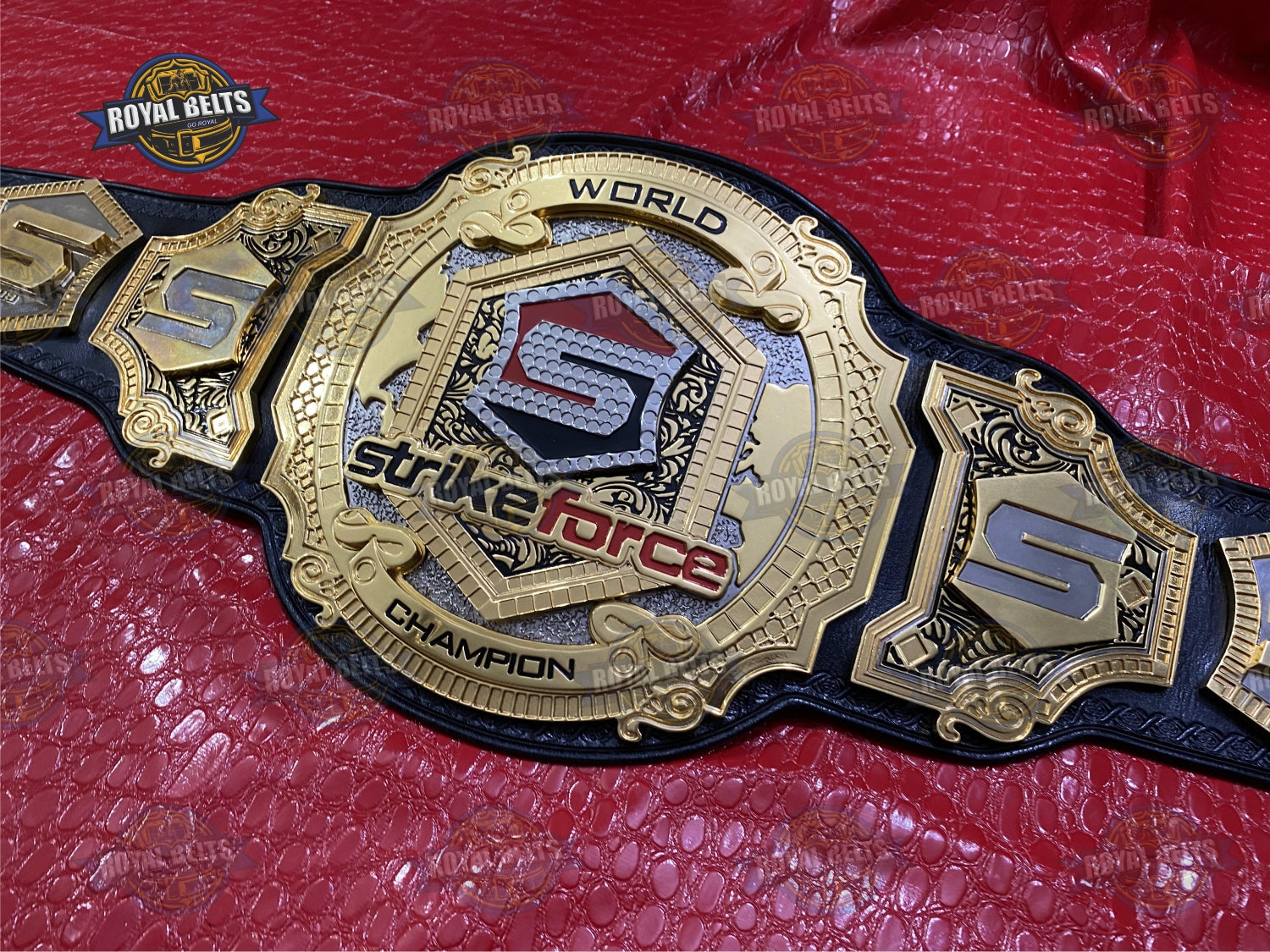 Strikeforce title belt with raised triple gold center, detailed CNC engraving, reinforced leather strap Manufacture by Royal Belts