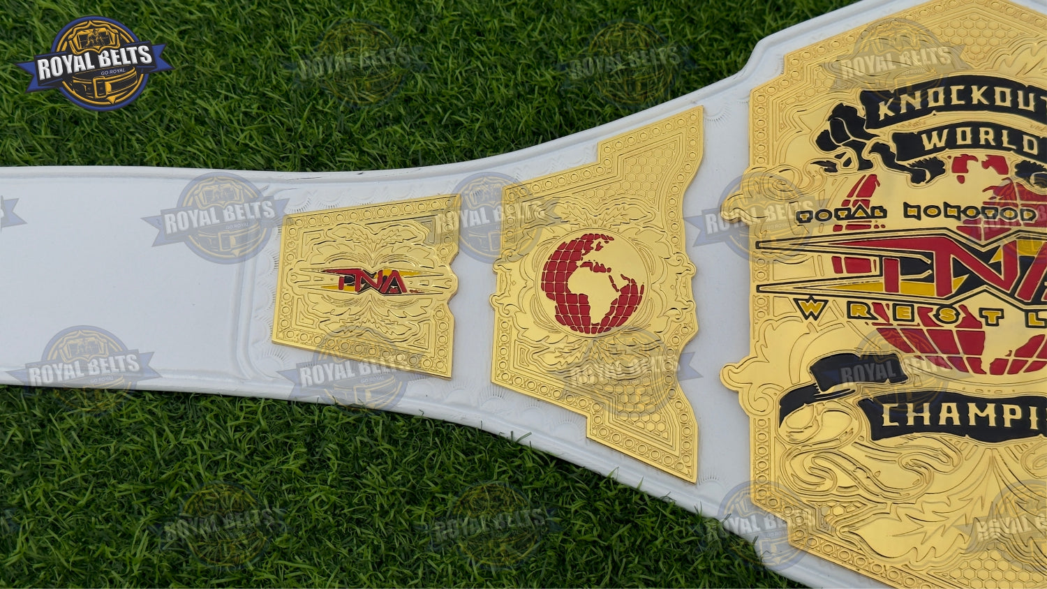 TNA World Championship Title Belt with gold engraved side plates and polished center