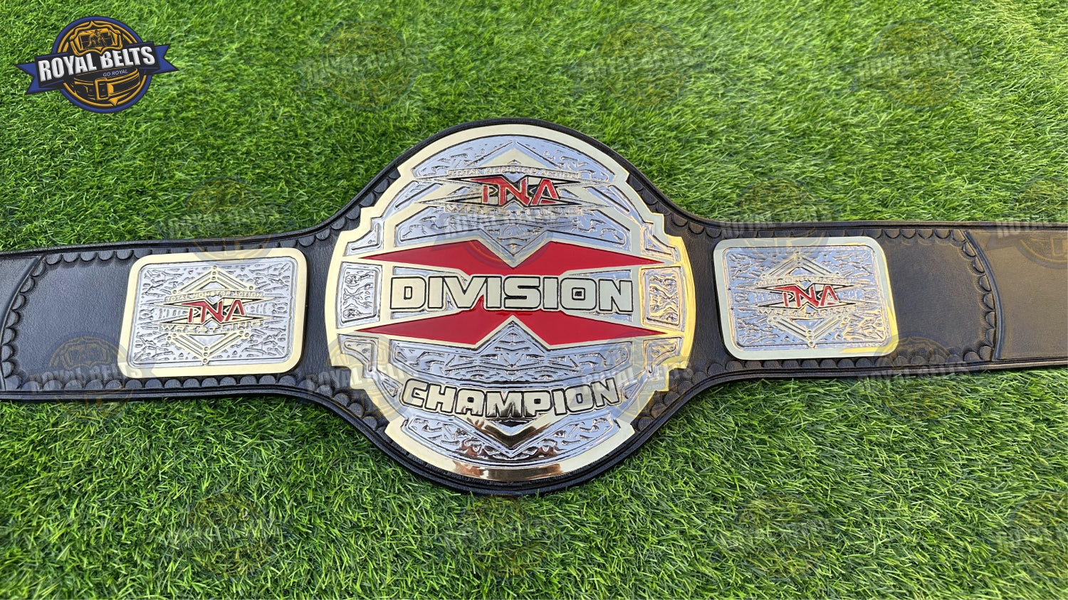 X Division championship belt featuring raised dual center plate, mirror polished finish, stitched leather backing Crafted by Royal Belts