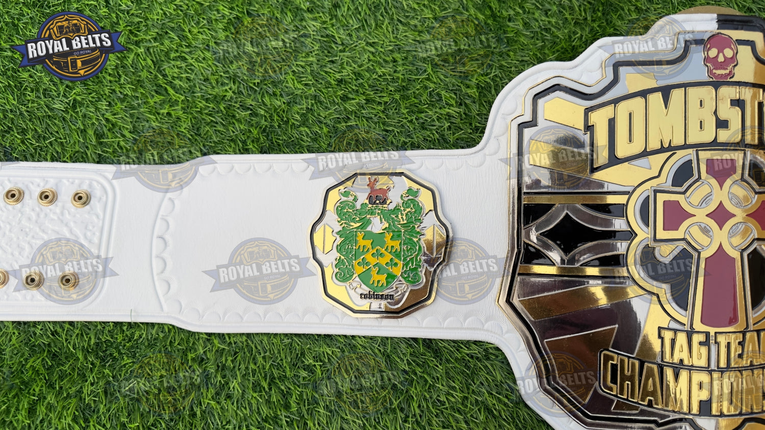 TOMBSTONE title belt featuring engraved gold plates and stitched leather strap