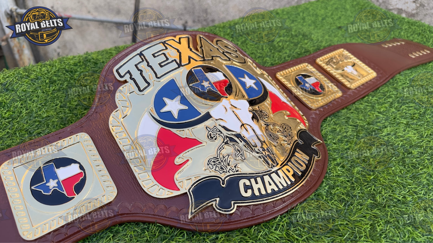 Heavyweight wrestling belt with embossed gold center, polished alloy finish, stitched brown leather