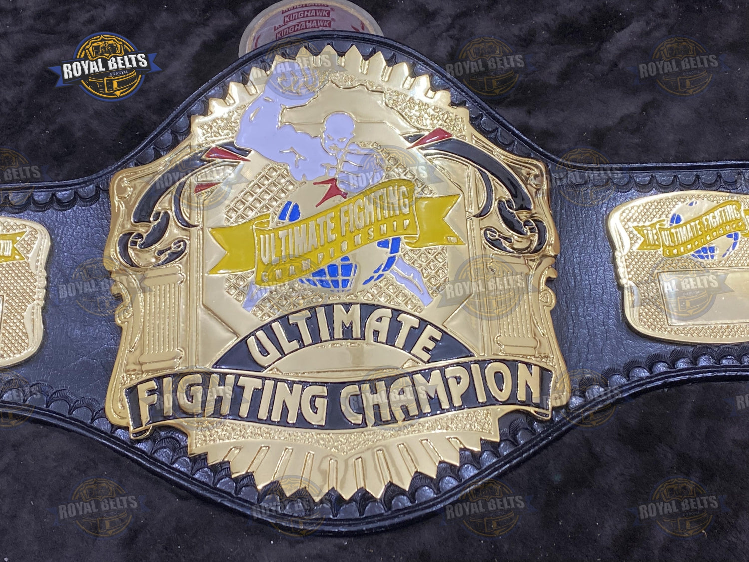 UFC Title Belt high relief engraved centerpiece with bold UFC text and detailed side plates Designed by Royal Belts