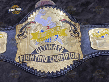 UFC Title Belt high relief engraved centerpiece with bold UFC text and detailed side plates Designed by Royal Belts