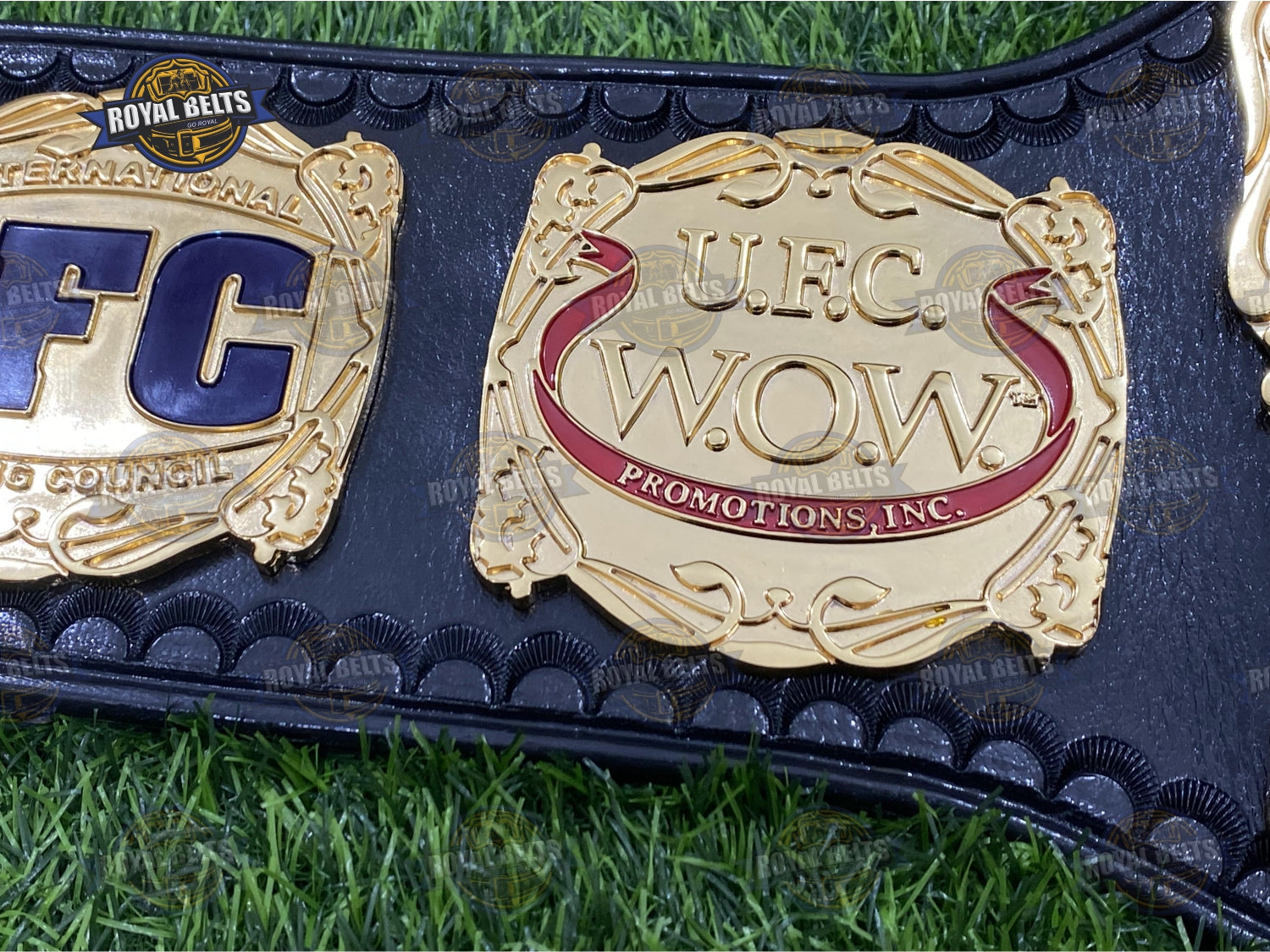 UFC Championship V belt with embossed gold center plate, polished alloy finish, thick black leather