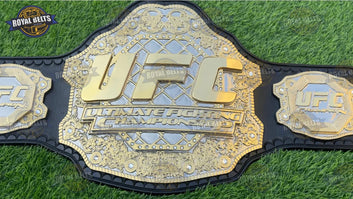 UFC double layered Ultimate Fight Championship Title Belt with raised UFC logo and polished gold finish Designed by Royal Belts