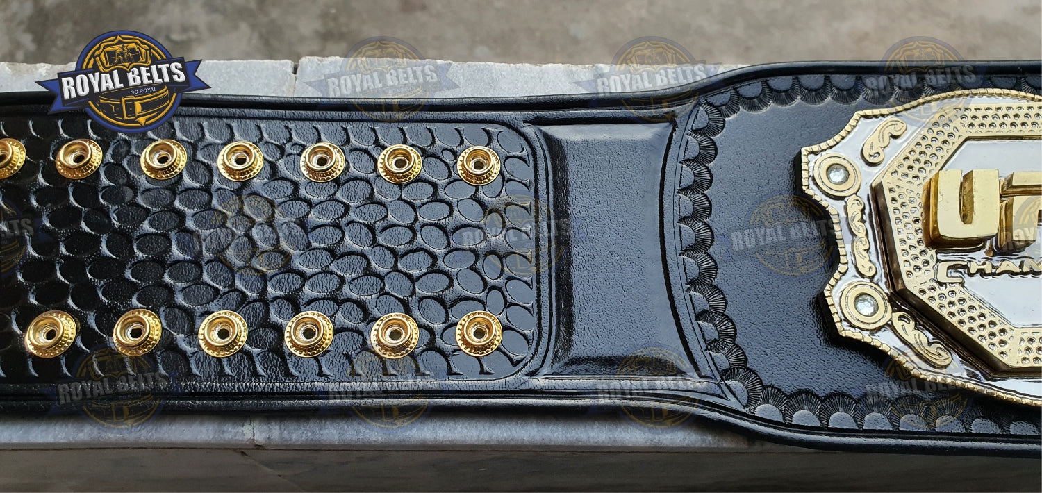 Ultimate Fight triple stacked belt with raised center emblem, polished gold layers, thick leather strap