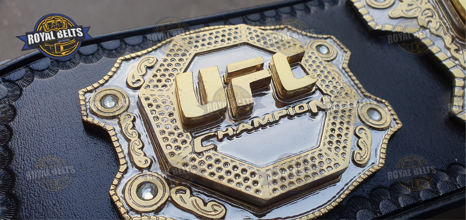 UFC title belt showcasing triple layered gold plates, deep engraving, durable black leather backing 