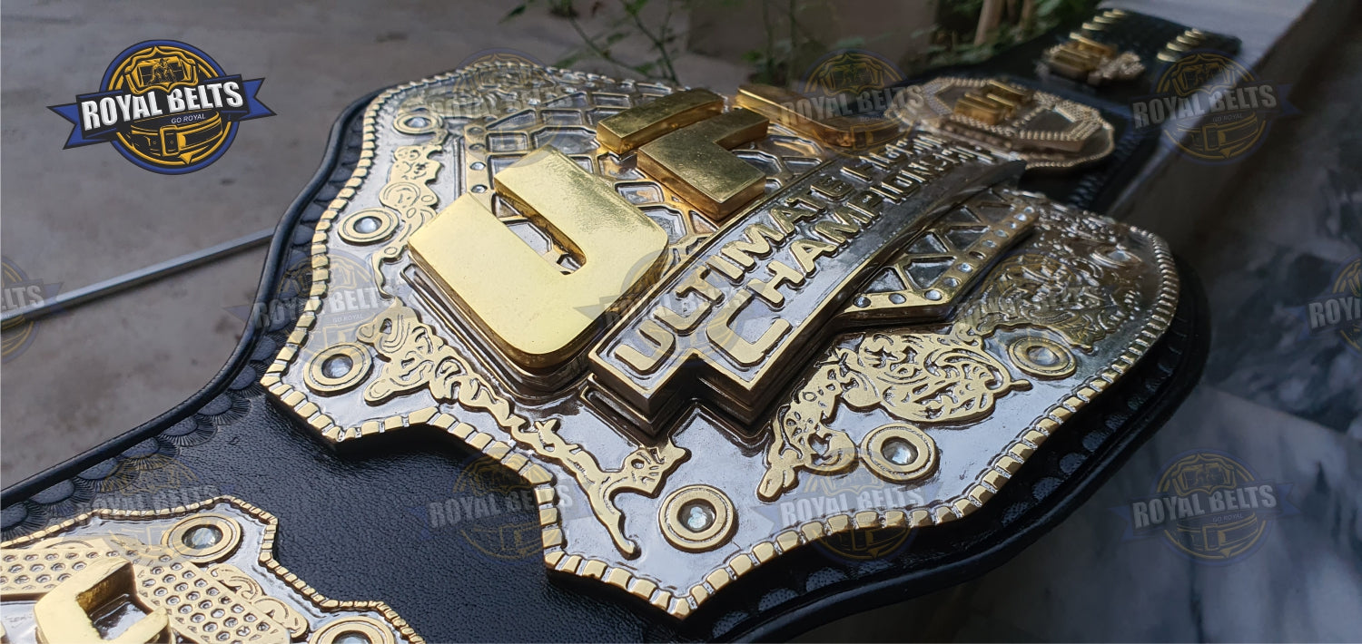 Ultimate Fight championship belt showcasing engraved triple stacked gold center, adjustable leather strap
