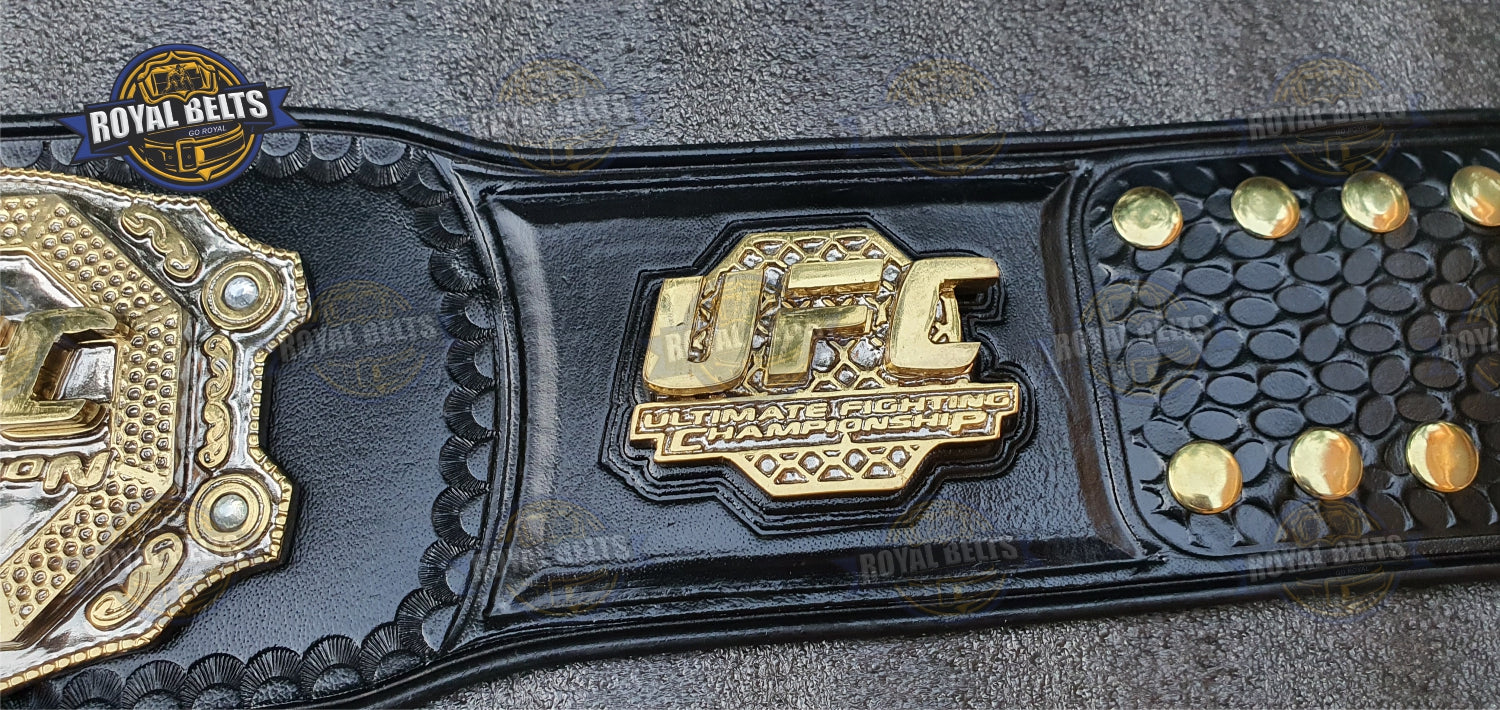 UFC triple stacked belt with bold raised center plates, mirror polished gold, reinforced backing