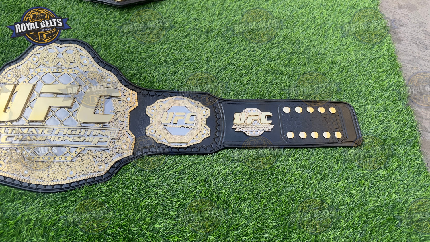 UFC triple stacked title belt with ornate side plates, deep etched details, thick black leather strap 