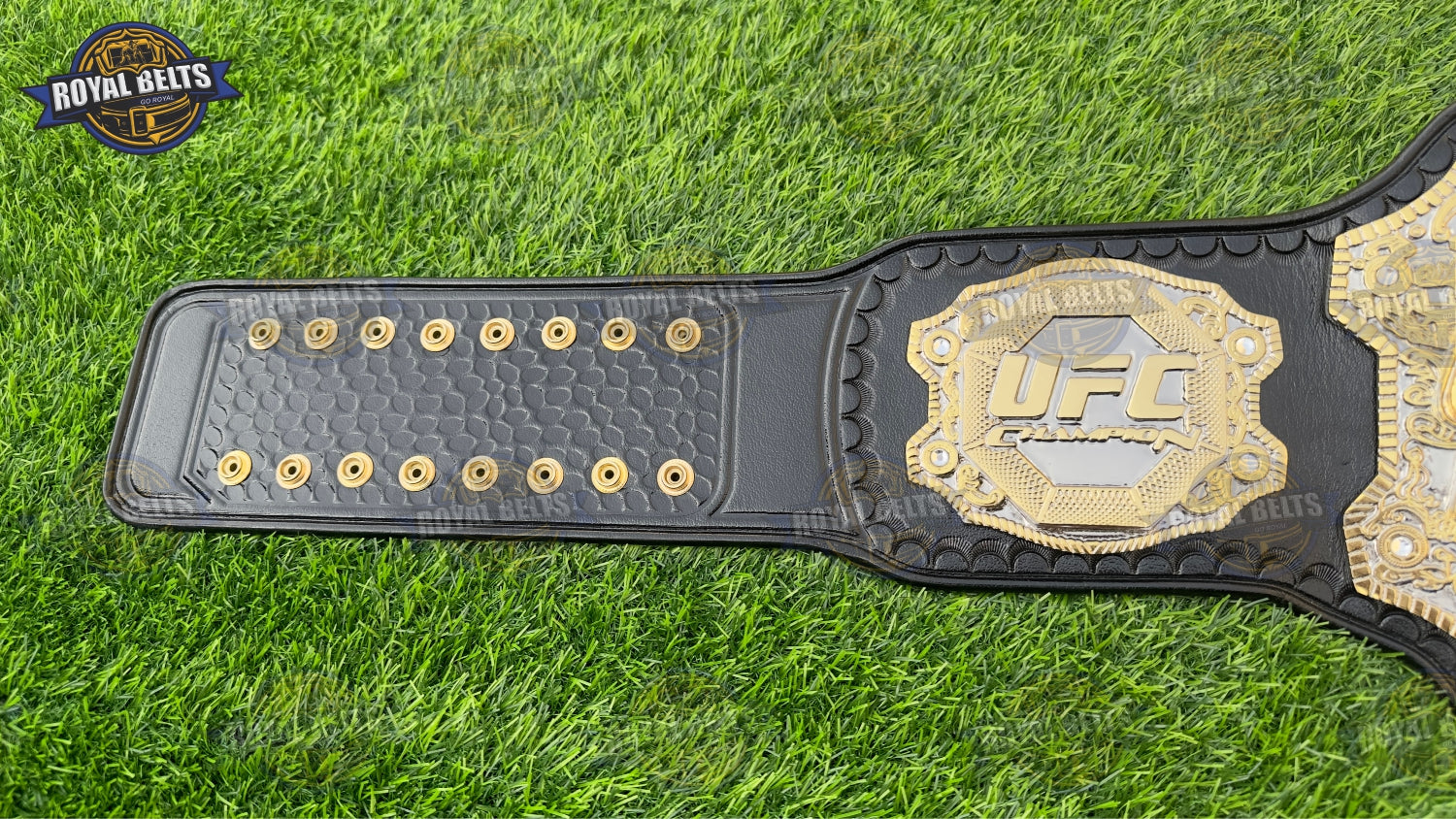 Ultimate Fight championship belt featuring embossed triple stack plates, polished gold alloy, leather backing