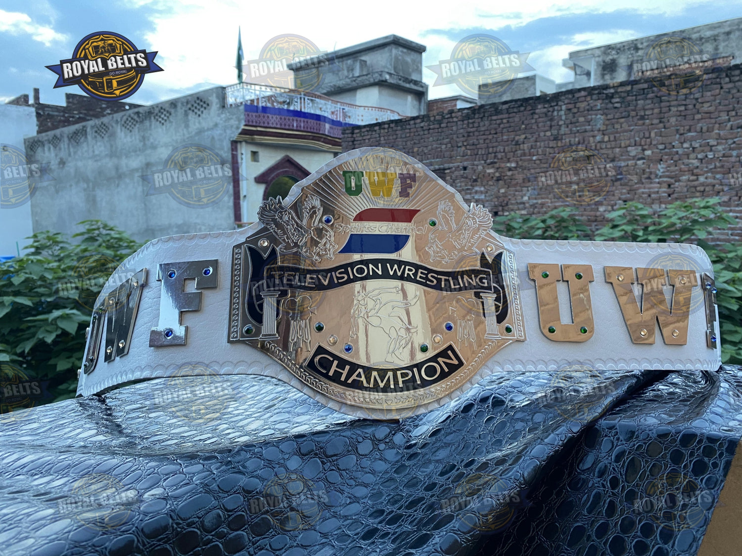 UWF Heavyweight championship belt with gold plated center plate, white leather strap, snap closure Crafted by Royal Belts