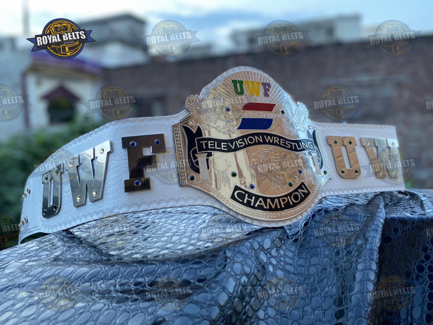 UWF Universal Wrestling Federation belt featuring engraved side plates, polished brass finish, stitched leather Crafted by Royal Belts