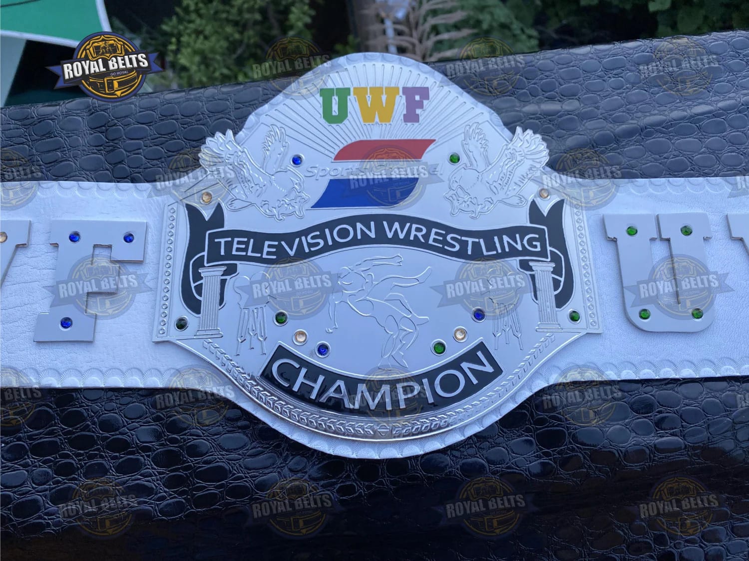 Custom UWF title belt with ornate side plates, detailed engraving, premium genuine leather strap