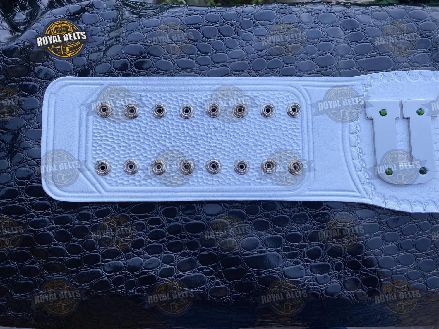 UWF Universal Wrestling Federation championship belt with bold embossed center, thick metal plates