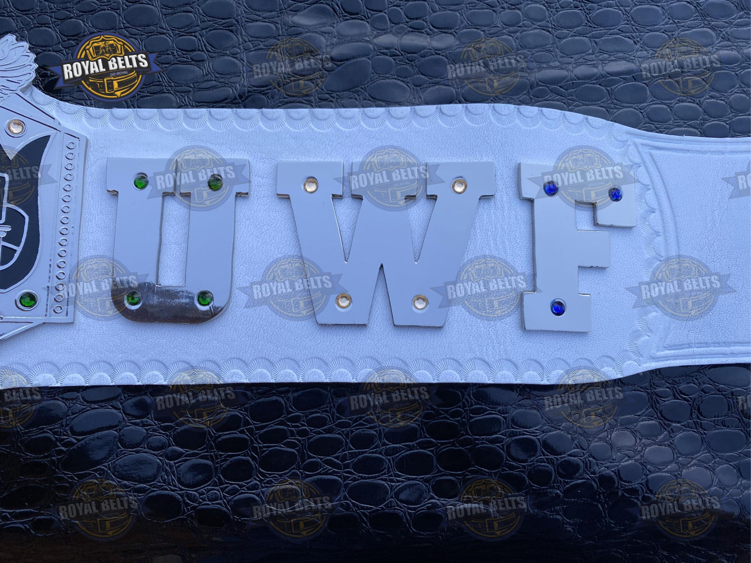 UWF Heavyweight championship belt with beveled chrome plates, smooth polished finish, adjustable leather