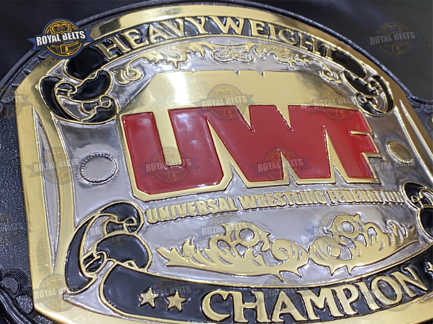 Heavyweight belt with ornate side plates, CNC etched center, high gloss dual finish, stitched black leather strap